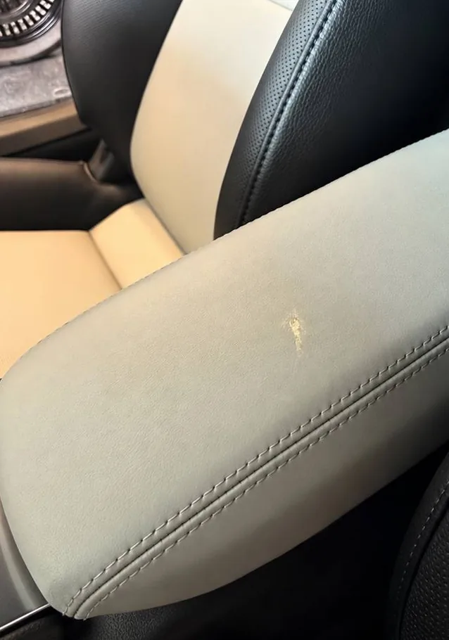 Before: gray leather center console armrest