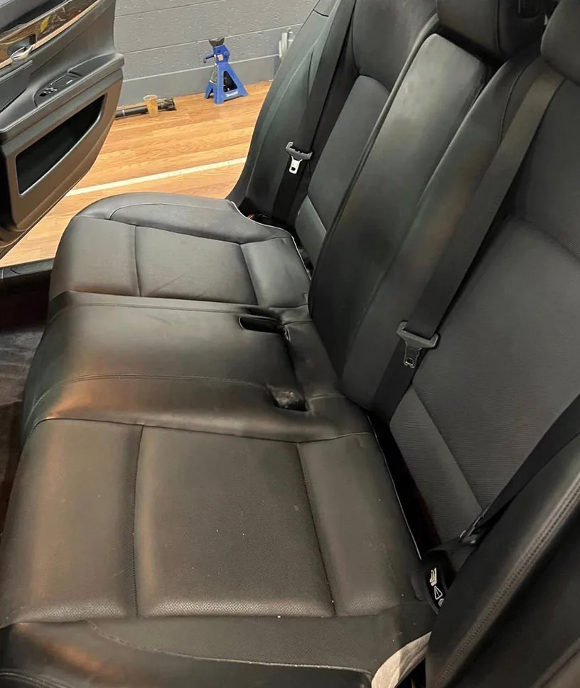 Before: luxury sedan rear seat, black then coral red