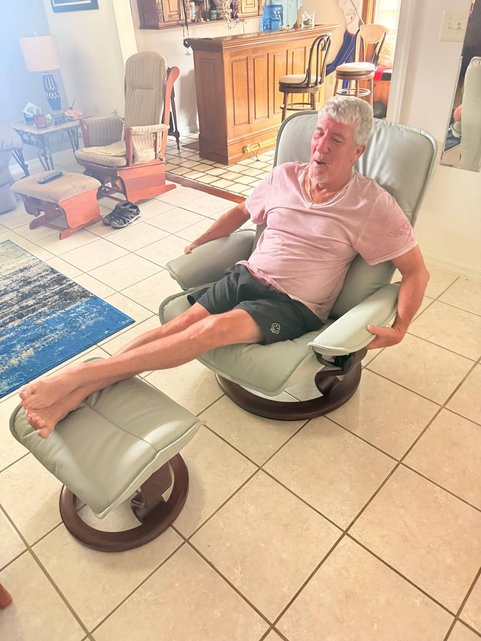Customer relaxing in his reupholstered recliner