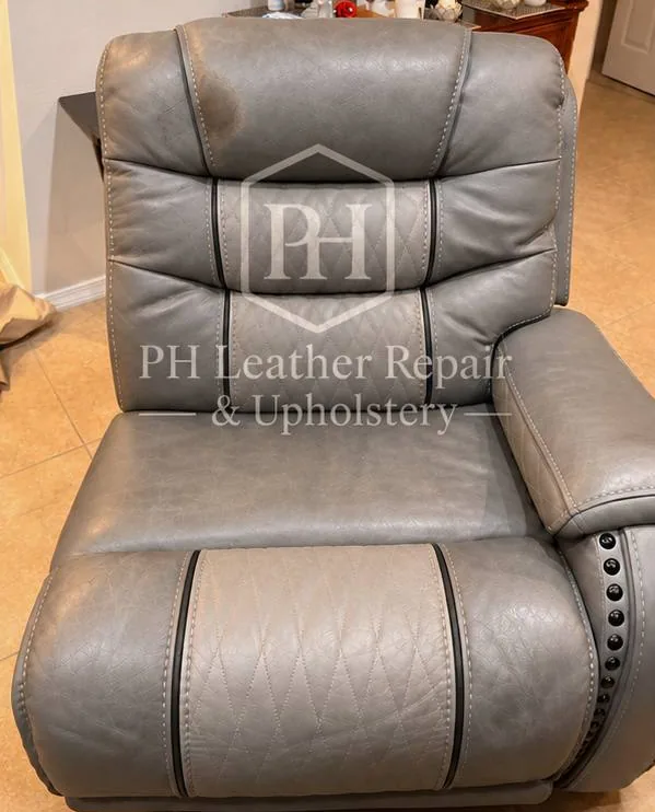 Before: gray leather power recliner headrest