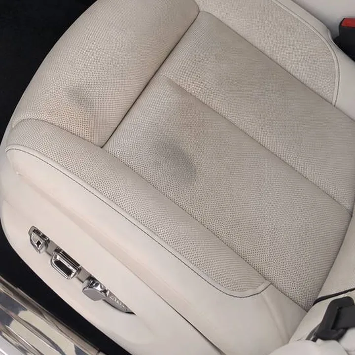 Faded, grimy light leather